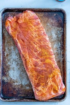 a piece of meat sitting on top of a pan