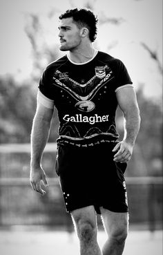 a man in black and white is playing soccer