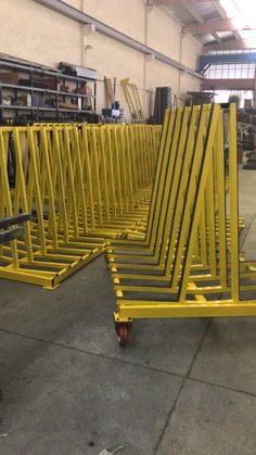 several yellow metal racks sitting on top of each other