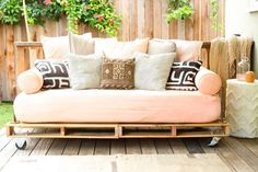 a couch sitting on top of a wooden pallet