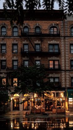 an old building is lit up at night