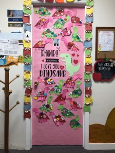 a pink door decorated with dinosaur magnets