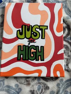 an orange and white painting with the words just be high on it