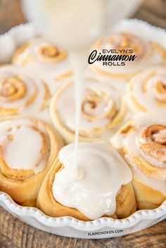 an image of cinnamon rolls being drizzled with icing