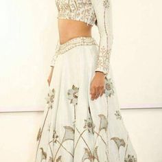 White Lehenga With Intricate Embroidery For Party, Wedding Sharara In Raw Silk With Sequins, White Sequined Sharara For Festive Occasions, Festive White Sequined Sharara, Traditional White Embellished Lehenga, White Embellished Traditional Lehenga, White Embellished Sharara With Traditional Drape, Traditional Embellished White Sharara, Embellished White Lehenga For Reception