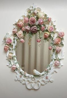 a mirror that has some flowers on it