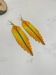 Beautiful yellow fringed earrings.  Made of Czech beads length 4.5 inches (11.5 cm) Width 1 inch (2.5 cm) Hypoallergenic clasp. If you want these earrings in a different color, write to me and I will be happy to make them for you. >Back to my shop: https://www.etsy.com/shop/jewelrybylarisa?ref=seller-platform-mcnav Cheap Yellow Beaded Earrings, Cheap Yellow Beaded Earrings For Summer, Yellow Dangle Jewelry With Tassels, Bohemian Yellow Dangle Chandelier Earrings, Yellow Handmade Tassel Earrings, Yellow Fringe Tassel Drop Earrings, Yellow Fringe Tassel Earrings, Yellow Fringe Jewelry Gift, Yellow Fringe Jewelry For Gift