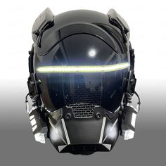 the futuristic helmet is designed to look like it has glowing eyes and head lights on