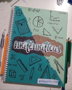 a notebook with the word metaticas written on it next to pencils and markers