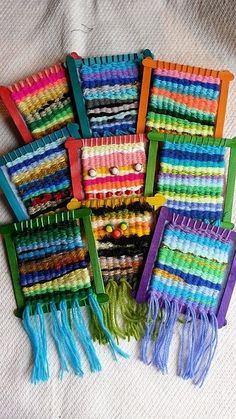 there are many different colors of toothbrushes on the white tablecloth, one is multicolored