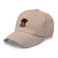 Inspired by the charm of the Scottish Highlands, our Embroidered Dad Hat features an adorable Highland Cow design, adding a touch of whimsy to your style. Crafted for comfort with detailed embroidery, it's your go-to for casual outings. The adjustable strap ensures a snug fit, making this hat the perfect blend of cozy and Scottish flair. Elevate your hat game with our Highland Cow Embroidered Dad Hat – where tradition meets playful fashion! Dad hats aren't just for dads. This one's got a low pro Playful Fashion, Scottish Highland Cow, Cow Design, Detailed Embroidery, Cozy Style, Camo Colors, Scottish Highlands, Green Camo, Highland Cow