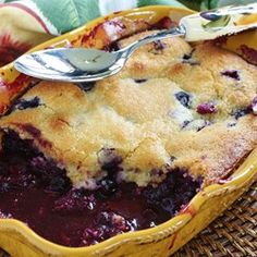 a close up of a pie in a pan with a spoon on top of it