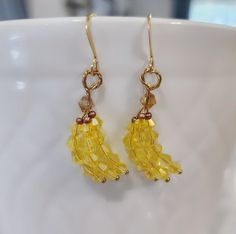 Yellow glass beaded banana bunch earrings. Super cute gift ideas for banana and fruit lovers🍌 I offer a variety of metal finishes of french hooks in case of sensitivity, but all of them are hypoallergenic and Nickle free! Check my FAQs for information on how to care for your metal jewelry.  Check out the pictures to see what each material style looks like.  French hook finishes available:  18k gold plated stainless steel  Gold plated brass  Silver plated brass  Rose gold plated brass  Sterling silver  I use high quality glass beads for all of my items. My main goal is to create beautiful peices that are also affordable!  Every item is made to order, If you like the style but prefer another color, I'm happy to customize it for you! Just message me what you're looking for, and we will come Banana Earrings, Girls Gift Ideas, Teal Earrings, Food Earrings, Fruit Earrings, Chakra Jewelry, Rainbow Earrings, Triangle Earrings, Girls Gift