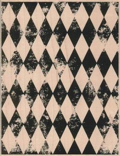 an old black and white checkerboard pattern with grungy paint on it