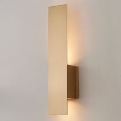 a wall light that is mounted on the side of a wall with a white background