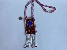 Indigenous Beaded Jewelry, Long Indigenous Necklace, Native American Ethnic Jewelry, Aboriginal Art, Authentic First Nations Art. The size of the rectangle (without tassel): 4.25" x 2.5"; Length of the neck chain/strap: 29". Beautiful condition Leather on the back. Let me know if you need any more pictures  ATTENTION: Small Packet (only for US and International) shipping option doesn't include Tracking Number!! * Small Packet US - approx 6-12 business days; * Tracked Packet US - approx 5-10 busi Traditional Beaded Fringe Necklace, Artisan Handwoven Rectangular Jewelry, Traditional Beaded Fringe Necklace As Gift, Traditional Rectangular Necklace For Festivals, Bohemian Rectangular Beaded Necklace, Bohemian Handwoven Rectangular Jewelry, Bohemian Jewelry With Large Rectangular Beads, Bohemian Rectangular Necklaces With Colorful Beads, Traditional Rectangular Jewelry With Colorful Beads