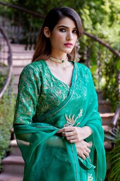 Emerald green silk organza saree with spring, zardozi placement embroidery. Comes with a blouse piece.
Component: 2
Pattern: Embroidery, Woven
Type Of Work: Spring, zardozi
Fabric: Saree - Silk Organza, Blouse - Brocade
Color: Green
Other Details: 
Border embroidered saree
Placement pattern
Note: Stitched blouse shown in the images is not for sale
Occasion: Reception - Aza Fashions Types Of Work, Green Saree, Green Spring, Luxury Sale, Organza Saree, Silk Organza, Green Silk, Sarees Online, Blouse Piece