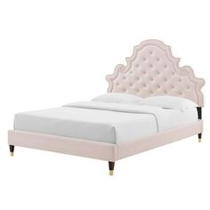 a pink bed with an ornate headboard and foot board on the bottom, in front of a white background