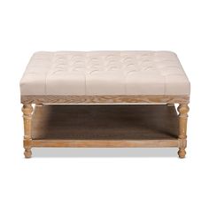 a wooden bench with a white upholstered cushion on it's top shelf