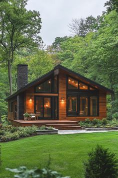 a house in the woods with lights on