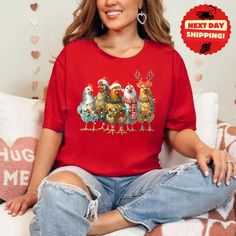 Funny Christmas shirt, Christmas Chicken tshirt, Bella Canvas T-Shirt Description: Discover the perfect blend of comfort and style with our Bella Canvas t-shirts. Known for their superior softness and modern fit, Bella Canvas shirts are crafted from high-quality, lightweight fabric that feels amazing against your skin. Whether you're dressing up or down, these versatile tees are perfect for any occasion. Premium Quality: Made from a blend of 100% Airlume combed and ring-spun cotton for a luxurio Casual Christmas T-shirt As Gift, Funny Long Sleeve Christmas T-shirt, Casual Pre-shrunk Christmas Shirt, Casual Christmas Tops With Funny Print, Casual Tops With Funny Print For Holidays, Holiday Crew Neck Top With Cartoon Print, Funny Print Tops For Christmas Gifts, Funny Print Tops For Christmas Gift, Casual T-shirt As Holiday Gift