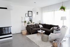 a living room filled with furniture and a fire place