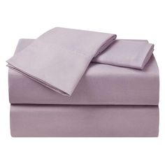 the sheets and pillowcases are made up in lilac color, with two pillows on each side