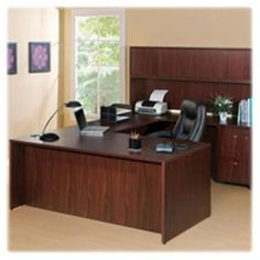 an office desk with a chair and computer on it