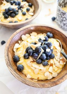 two wooden bowls filled with blueberries and oatmeal