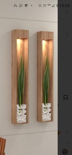 two wooden wall mounted vases with flowers in them