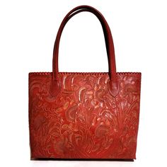 This one of a kind Hand-Tooled Leather Tote  has beautiful chiseled floral designs with vegetable tanned leather.  This bag have  a fully suede leather lined interior, features 2 small zipper pocket for all your essentials  The perfect choice as a gift for her!  Best for casual and everyday wear,  making this a wonderful go-to bag. ❇️Measures : height:28 cm. (11 inches) width at the bottom: 34cm.  (13.5 inches) width at the top: 40cm. (15.7 inches) base:13 cm. (5 inches) straps:22cm (8.5 inches) Everyday Embossed Tote Satchel, Red Shoulder Bag With Leather Lining As Gift, Hand Tooled Rectangular Bag For Daily Use, Embossed Tote Bag For Everyday Use, Everyday Embossed Tote Bag, Hand Tooled Tote Shoulder Bag For Daily Use, Red Bag With Leather Lining As Gift, Red Hand Tooled Bag For Daily Use, Embossed Double Handle Shoulder Bag For Everyday Use