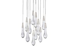 a bunch of glass drops hanging from a ceiling fixture with one light on each side