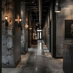 An industrial hallway with a monochromatic color scheme of varying shades of gray and black, from the concrete floors to the metal accents and exposed ductwork2 Industrial Entryway Ideas, Modern Industrial Entryway, Industrial Warehouse Design, English Farmhouse, Warehouse Design, Famous Interior Designers