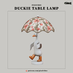 the duckie table lamp is designed to look like it has an umbrella over its head