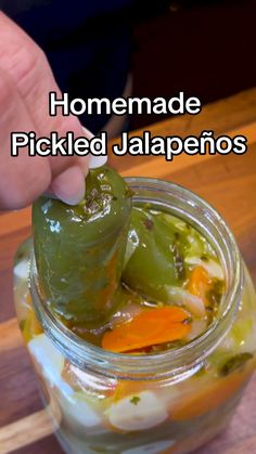 pickled jalapenos in a jar with text overlay that reads homemade pickled jalapenos