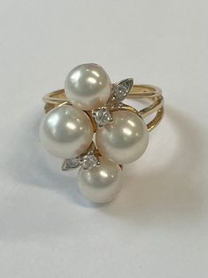 14K yellow gold ring with four cultured pearls, two are 6-6.5 mm and two are 6.5-7 mm, and four little diamonds. Finger size is a 4 US. Ring is stamped 14K and has a hallmark that we cannot make out. Luxury Pearl Ring With Gemstone For Wedding, Luxury Heirloom Oval Pearl Ring, Luxury Timeless Yellow Gold Pearl Ring, Pearl And Diamond Engagement Ring, Pearl Wedding Ring, 18k Gold Chain, Herringbone Necklace, Happy Things, Lovely Ring