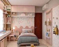 a bedroom decorated in pastel tones with pink walls and furniture, including a bed