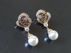 Wedding White Pearl Gold CZ Vintage Style Bridal Earrings. PLEASE READ ITEM DESCRIPTION and SHOP POLICIES before placing your order, and contact me with any questions! EARRINGS are about 1.10 inch (2.8cm) long from top of ear stud to bottom. BRIDAL EARRINGS SECTION: https://www.etsy.com/shop/LanaChayka?ref=seller-platform-mcnav§ion_id=11638940 BRIDAL JEWELRY SETS SECTION: https://www.etsy.com/shop/LanaChayka?ref=seller-platform-mcnav§ion_id=25839214 BRIDAL NECKLACES SECTION: https://www.etsy.com Gold Round Crystal Earrings For Wedding, Elegant Round Bridal Earrings, Gold Clip-on Earrings For Wedding, Gold Elegant Clip-on Earrings For Wedding, Formal Gold Bridal Accessories With Pearl Drop, White Round Clip-on Earrings For Wedding, Gold Teardrop Clip-on Earrings For Wedding, Gold Clip-on Earrings With Pearl Drop For Wedding, Luxury Gold-plated Pearl Drop Bridal Earrings