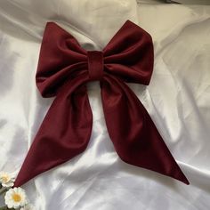 Add a touch of charm and sophistication to your hairstyle with this elegant heavier weight clip on hair bow in a burgundy red velvet. This large adult oversize hair bow is the perfect fashion accessory to effortlessly elevate your look for any occasion. Handcrafted with care, this handmade fabric hair bow clip adds a touch of classic glamour, sophistication and style to your outfit, whether you're heading to a special event, wedding or simply want to add a chic flair to your everyday look. Stand Red Bow Hair Clip, Red Bow In Hair, Red Bow Hair, Bow Hair Clip, White Rabbit Costumes, Red Hair Clips, Wine Hair, Fabric Hair Bows, Dark Red Hair