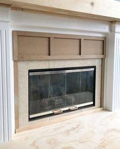 an empty fireplace with no mantle in the middle