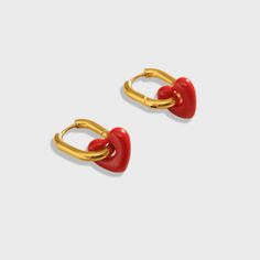 The Lover Rouge Huggie Earrings are designed with a stunning red heart pendant, designed to make a statement. Wear these trans-seasonal earrings to elevate any outfit for any occasion. Love these earrings and keep them safe in the Biella Vintage Jewellery box provided. 18K Gold plated Red pendant heart Biella Vintage Jewellery Box Free Worldwide Shipping Trendy Earrings For Valentine's Day Gift, Trendy Valentine's Day Earrings For Gift, Trendy Valentine's Day Gift Earrings, Trendy Heart Drop Earrings As Gift, Single Earring For Valentine's Day, Trendy Heart-shaped Earrings For Gifts, Trendy Heart Shaped Earrings For Gifts, Trendy Red Jewelry With Matching Earrings, Trendy Red Jewelry Set With Matching Earrings