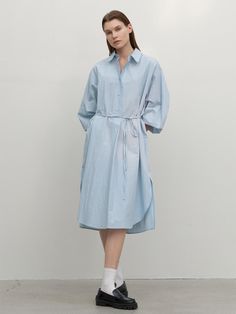 This long shirt dress from Atelier Nain features a wide placket and a half-open design, offering comfort without the gap between buttons.- With a belt to accentuate the waistline- Oversized fit for comfortable wear experience- The uneven hemline to add a unique point of interest* Model shots may differ from the actual product color due to shooting location, time, and graphic techniques. Refer to the product cut images for the actual color. Knee-length Shirt Dress With Roll-up Sleeves For Daywear, Spring Midi Shirt Dress With Roll-up Sleeves, Relaxed Fit Shirt Dress With Tie Waist For Daywear, Spring Shirt Dress With Tie Waist And Relaxed Fit, Spring Relaxed Fit Shirt Dress With Tie Waist, Casual Long Sleeve Belted Dress For Daywear, Spring Oversized Shirt Dress With Roll-up Sleeves, Relaxed Fit Belted Shirt Dress For Spring, Casual Belted Shirt Dress For Daywear