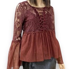 A Beautiful Brown Plunging V Neckline With Lace Up Long Semi Sheer Bell Sleeve, Empire Waist With Matching Cami Tank Peplum Trim Blouse By Taylor & Sage. A Great Style For Year Round Attire! Women’s Size Large Chest 36-38” Sleeve 24” Flared Sleeves 28" Length 23” Material: Nylon, Rayon Corset Tops Gorgeous Unique Coloring And Universal Staple For Formal To Casual Attire! A Bohemian To Souther Goth Style Top! Brown And Dark Red Hue Lace Up Neckline, Perfect Peplum Semi Sheer Long Tulip Sleeves Pe Elegant V-neck Peasant Top For Fall, Fall V-neck Blouse With Lace Patchwork, Feminine Fall Blouse With Lace Patchwork, Feminine Lace Patchwork Blouse For Fall, Chic Fall Blouse With Lace Patchwork, Chic Lace Patchwork Blouse For Fall, Chic Lace Patchwork Tops For Fall, Fitted Peasant Top With Ruffles For Fall, Fall Party Tops With Lace Patchwork