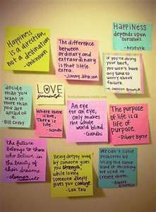 post - it notes pinned to the wall with words written on them