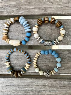 "Set of 4 boho style bracelets all in the same color scheme. I used many of the same elements to create these beauties including blues, ivory silver and wood tones. They are alls sold separately but work well with any combination. They are perfect together. All strung on clear elastic cord. I size them to 7\" which is the average woman's wrist size. Bracelet 1: Thai Blue Glass beads/Thai white glass beads/ bone saucer/silver flower discs/silver ethnic focal/ silver toned accents Bracelet 2: Thai Bohemian Turquoise Bracelets With Wooden Beads, Bohemian Blue Bracelets With Wooden Beads, Blue Bohemian Beaded Bracelets With Wooden Beads, Bohemian Blue Beaded Bracelets With Wooden Beads, Rustic Blue Adjustable Beaded Bracelets, Rustic Adjustable Blue Beaded Bracelet, Rustic Blue Adjustable Beaded Bracelet, Rustic Handmade Blue Beaded Bracelets, Stretch Beaded Bracelets Diy