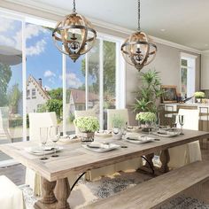 a dining room table and bench in front of large windows with glass doors leading outside