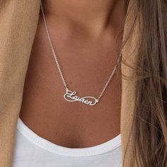 "Own Engraved Nameplate Jewelry Gifts for Her: Customizable dainty nameplate necklace in 18k gold, rose gold, sterling silver 925. The perfect gift for mom, grandma, wife, sister, best friend or yourself. ✨ SIZE & MATERIALS ✨ Material: Sterling Silver 925, 18K Gold Plated Sterling Silver 925, 18K Rose Gold Plated Sterling Silver 925, 18K Gold Vermeil Plated Sterling Silver 925 Thickness: 1.1mm / 0.04\" Height of pendant: 11.18mm x 34.29mm / 0.44\" x 1.35\" Chain style: Cable Chain length: 14\" + Silver Name Necklace With Clavicle Chain For Birthday, Elegant Silver Infinity Name Necklace, Silver Infinity Name Necklace, Silver Engraved Infinity Necklace, Sterling Silver Nameplate Necklace With Clavicle Chain, Personalized Sterling Silver Name Necklace With Adjustable Chain, Personalized Infinity Jewelry In White Gold, Elegant Infinity Necklace With Custom Name, Personalized Infinity White Gold Jewelry