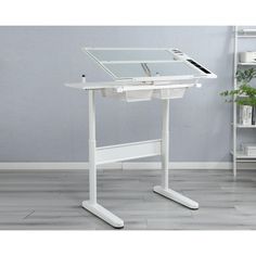 a white standing desk with a glass top