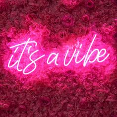 it's savillie neon sign in the middle of pink rose petals on display