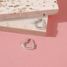 A simple pair of heart shaped huggie hoop earrings that any teen girl would love to receive as a special birthday present or valentines day gift. She will love the snug fit of this simple huggie, crafted from a 925 sterling silver, this pair of huggies are both safe and comfortable for young girls with sensitive ears. Featuring a hinged closure for more security, these earrings will surely become her go to pair with all of her outfits. Gift box included with purchase. Age Group: Sweet for Babies, Toddlers or Little Girls; Safe for Sensitive Ears 925 Sterling Silver Huggie Size: 11mm x 11mm Metal Stamp: 925 Gift Box Included Cheap Huggie Heart Earrings For Pierced Ears, Cheap Huggie Hoop Earrings For Valentine's Day, Cheap Huggie Heart Earrings, Cheap Heart-shaped Huggie Earrings, Cheap Nickel-free Heart-shaped Hoop Earrings, Cheap Huggie Heart Earrings For Valentine's Day, Cheap Pink Huggie Earrings Gift, Affordable Huggie Heart Earrings As A Gift, Cheap Heart-shaped Huggie Earrings For Valentine's Day